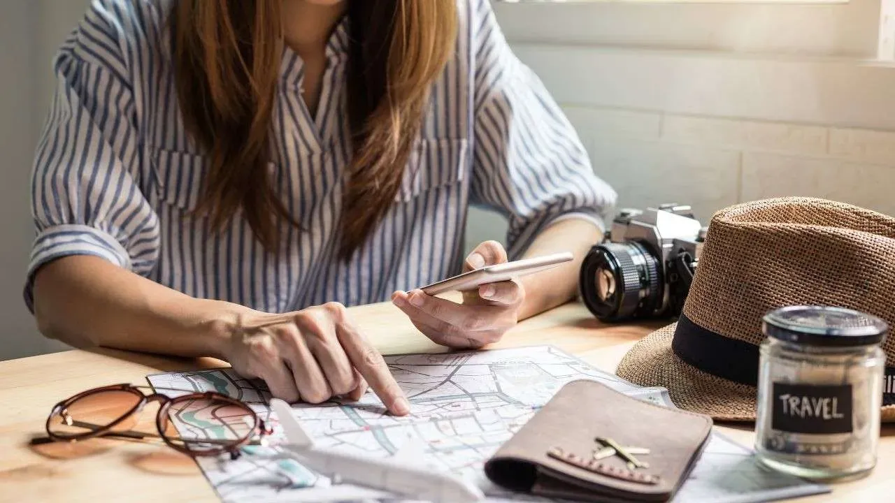 A woman planning her trip sincerely.