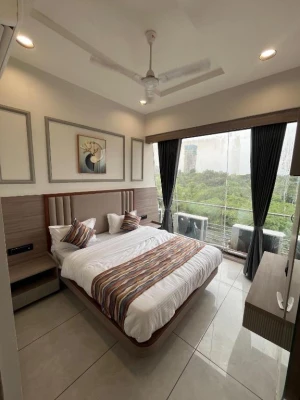 hotel with free parking in gota, ahmedabad - hotel acme sky
