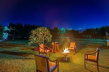 hotel with swimming pool in ladpur, alwar - elivaas riveria hills 3 bhk wooden cottage with lush garden & pvt pool