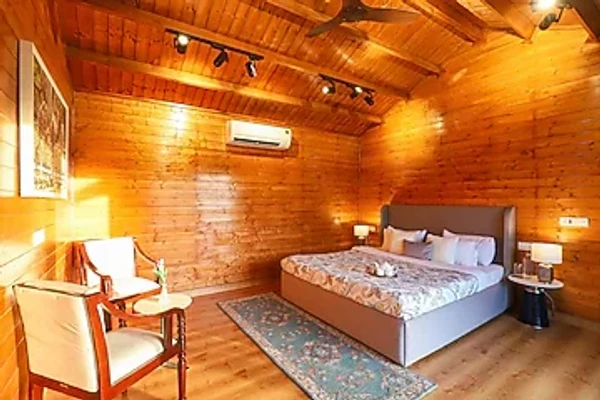 jacuzzi hotel in ladpur, alwar - elivaas riveria hills 3 bhk wooden cottage with lush garden & pvt pool