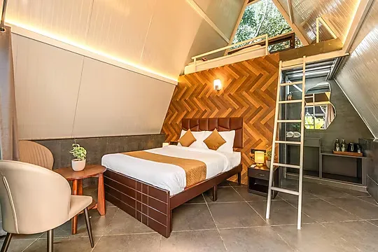 budget hotel in yelahanka, bangalore - alaya stays inara retreat cottage with a mezzanine loft, shared pool