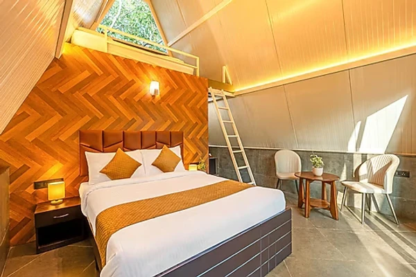 hotel with swimming pool in yelahanka, bangalore - alaya stays inara retreat cottage with a mezzanine loft, shared pool