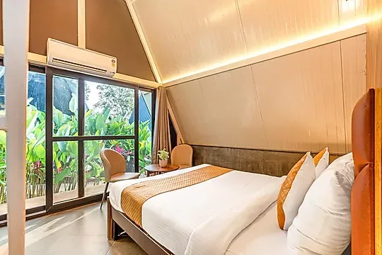 hotel room booking in yelahanka, bangalore - alaya stays inara retreat cottage with a mezzanine loft, shared pool