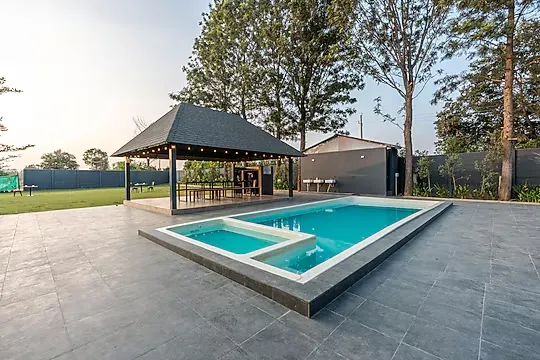 online room booking in yelahanka, bangalore - alaya stays inara retreat cottage with a mezzanine loft, shared pool