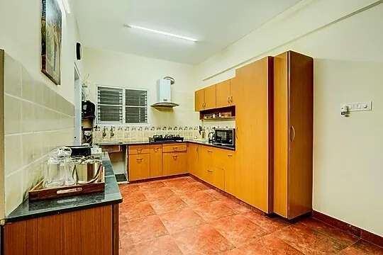 family hotel with pool in btm layout, bangalore - alaya stays saffron breeze apartment with common living & lift