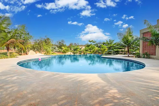 hotel with free parking in tavarekere, bangalore - elivaas urvi pool resort in bangalore