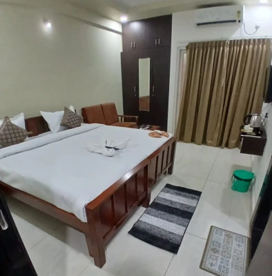hotel room booking in thanisandra, bangalore - hotel santhi comfort