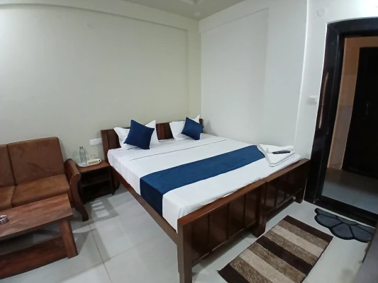 hotel with gym in thanisandra, bangalore - hotel santhi comfort