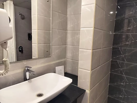 hotel with meeting room in hbr layout, bangalore - vits select bangaluru