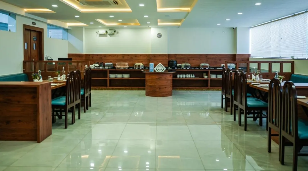 hotel with swimming pool in kadugodi, bangalore - zip by spree hotels purple orchid whitefield