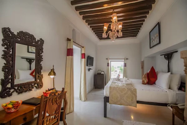 budget hotel in paharsar, bharatpur - amritara chandra mahal haveli