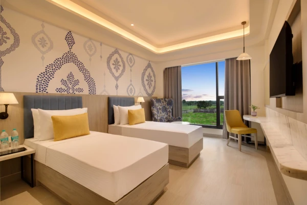 hotel with swimming pool in bholav, bharuch - lemon tree hotel bharuch gujarat