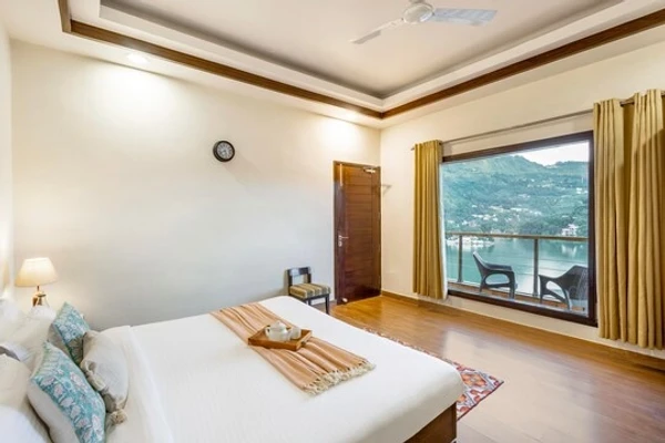 hotel with swimming pool in bhimtal lake, bhimtal - elivaas lakeview manor 4 bhk with garden & balconies nainital