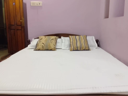 hotel with party hall in koyambedu, chennai - adi guest house