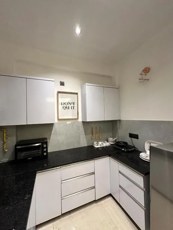 service apartment in saket, delhi for unmarried couples - cozy den by vaila stays