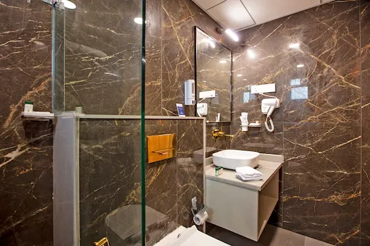 family hotel with pool in bhathan chowk, dwarka - grand continent dwarka