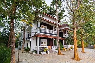 hotel with gym in malayattoor, ernakulam - elivaas vintage retreat  5 bhk riverfront heritage villa