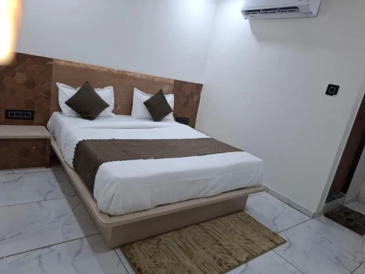 family hotel with pool in randheja, gandhinagar - hotel asiana