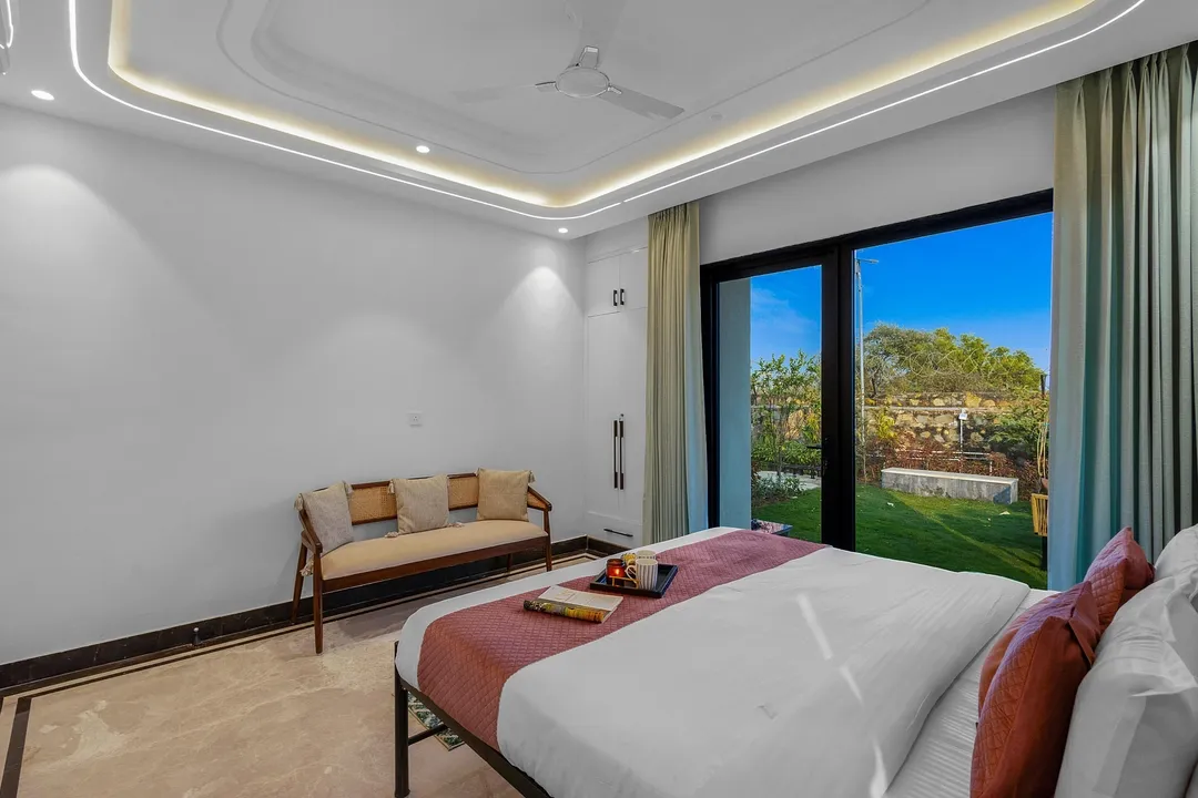 hotel room booking in sohna road, gurugram - elivaas prassanam vatika 2 bhk hillside villa with private pool