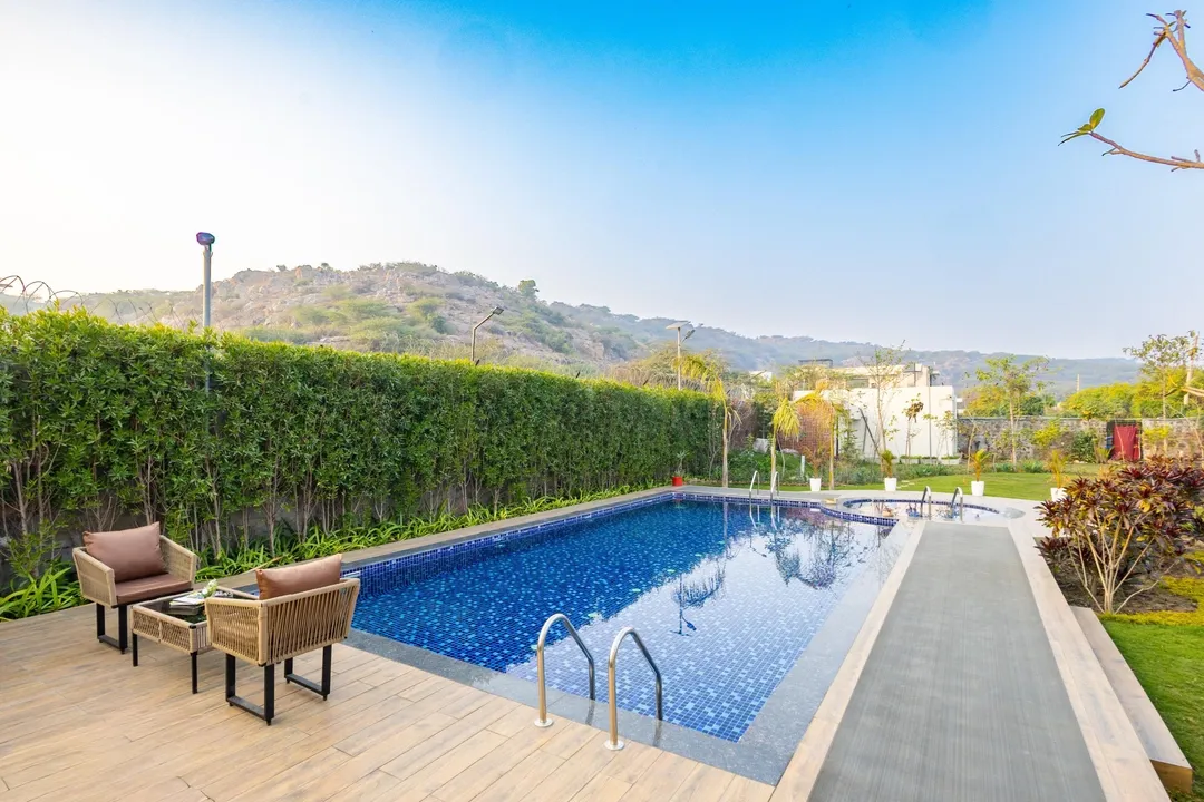 hotel near gurugram airport - elivaas prassanam vatika 2 bhk hillside villa with private pool