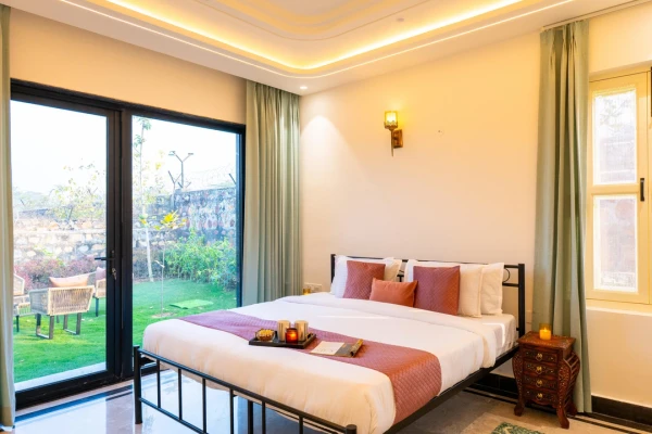 hotel with free parking in sohna road, gurugram - elivaas prassanam vatika 2 bhk hillside villa with private pool