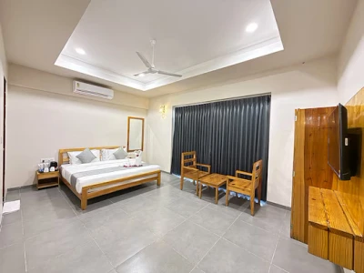 hotel with party hall in navagam, halol - daksh the nirvana retreat