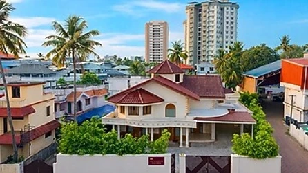 hotel with banquet hall in kaloor, kochi - elivaas valiyaveetil mansion 5bhk mansion with pvt pool & theatre