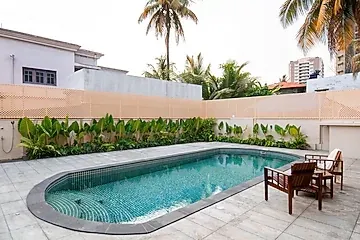 online room booking in kaloor, kochi - elivaas valiyaveetil mansion 5bhk mansion with pvt pool & theatre