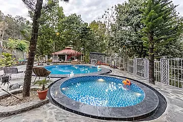 hotel with swimming pool in bhediyana, mussoorie - elivaas zephyr kumaon cottage hillside retreat with common pool, gym & restaurant