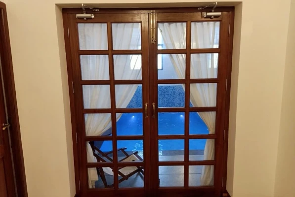 hotel with swimming pool in nazarbad, mysore - vismaya comforts