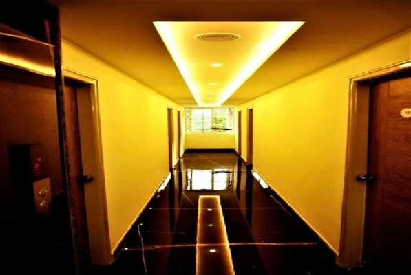 hotel with swimming pool in nazarbad, mysore - vismaya comforts