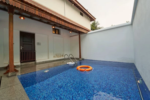 family hotel with pool in nazarbad, mysore - vismaya comforts