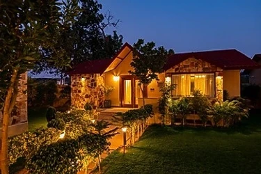 family hotel with pool in ranthambore road, sawai madhopur - elivaas tiger cave suite room with pool and garden