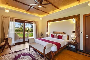 hotel with swimming pool in ranthambore road, sawai madhopur - elivaas tiger cave suite room with pool and garden