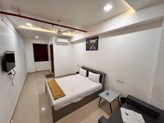 budget hotel in vesu, surat - hotel nirali rooms - nexus hospitality
