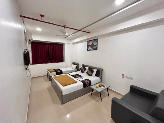 hotel near surat airport - hotel nirali rooms - nexus hospitality