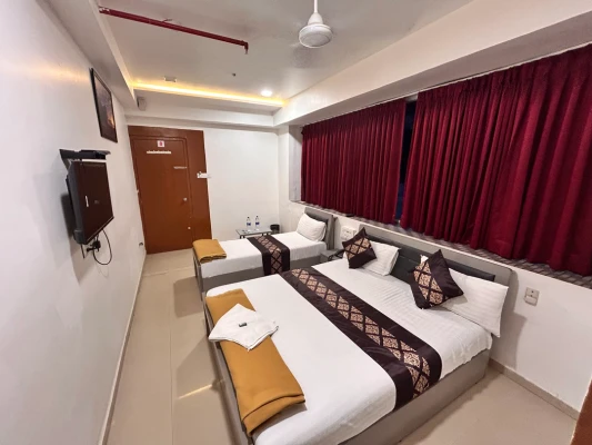 best day stay hotels in hotel nirali rooms - nexus hospitality surat