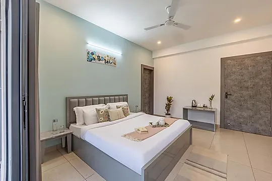 hotel with swimming pool in badgaon, udaipur - alaya stays lakecity heights 2bhk with balcony & hill view udaipur