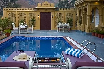 hotel with swimming pool in kundal ubeshwarji, udaipur - elivaas amber royale 3 bhk with pvt pool & terrace udaipur