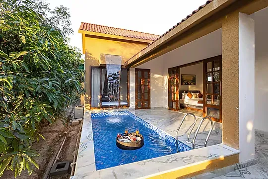 hotel with gym in kavita, udaipur - still river suites by elivaas with heated pool & jacuzzi udaipur